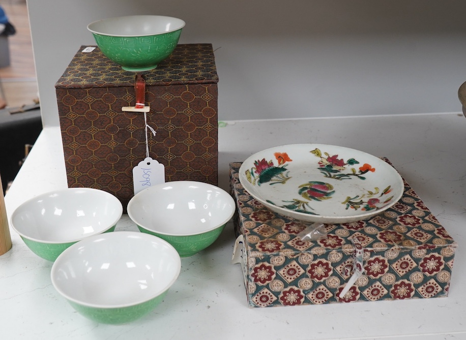 A set of four Chinese green glazed and moulded bowls and a famille rose dish, 19th and 20th century, boxed, largest 17cm. Condition - one bowl cracked